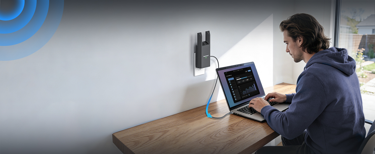 Shows a Laptop Connected to WiFi via Ethernet while a Young Man Works at a Desk