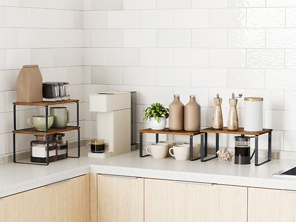 a kitchen counter with a white tile wall and a coffee maker.