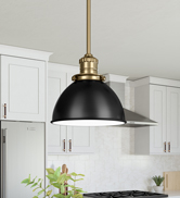 Pendant light in satin gold, with matte black metal shade.