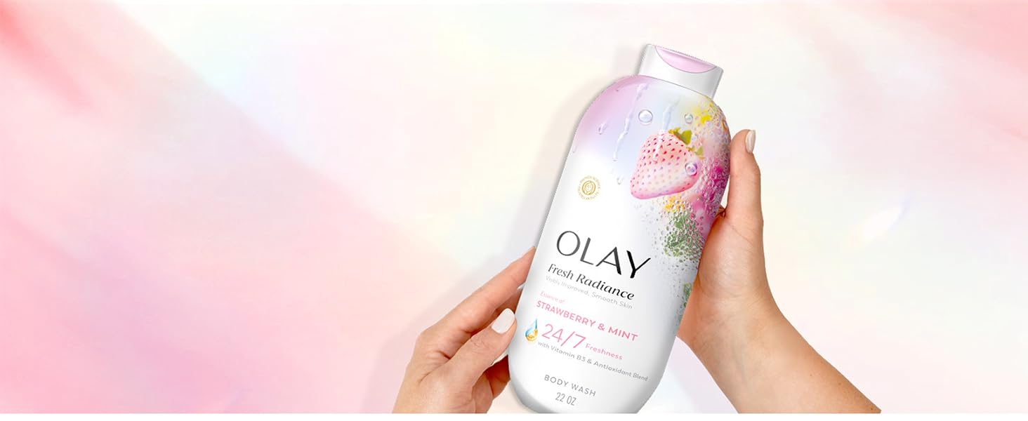 Olay Fresh Radiance Strawberry &amp;amp; Mint in front of a pink background