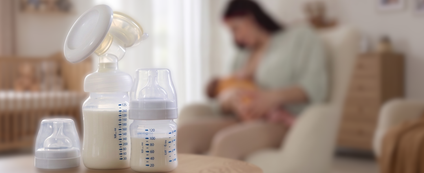mother breastfeeding child with pump and bottles and breastmilk