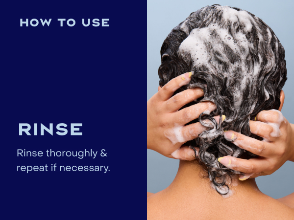 Image of a woman rinsing her hair with product.