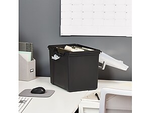 open black plastic file box sitting on top of white desk