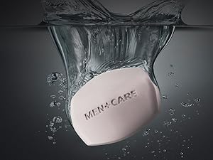 Picture of Dove Men+Care cleansing bar being dropped into water. 