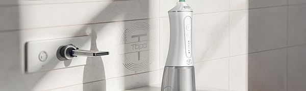 TBPO cordless water flosser on bathroom sink – portable oral irrigator for daily dental care