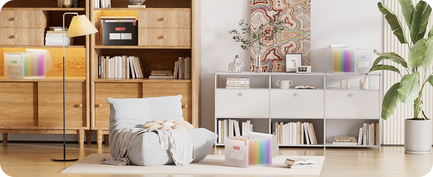 Modern living room with wooden and white storage units. Floor cushions, books, and colorful rainbow accents create a cozy reading nook. Potted plant adds greenery to the space.