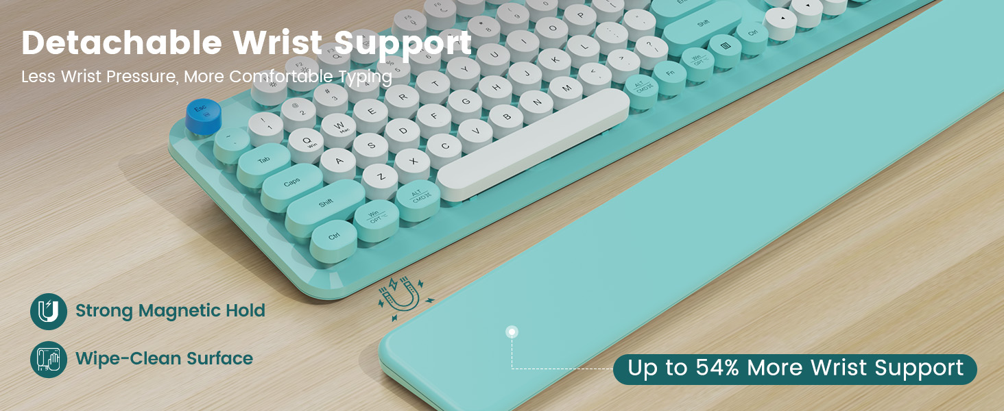 Keyboard on desk with detachable magnetic wrist rest, showing strong hold and wipe-clean surface.