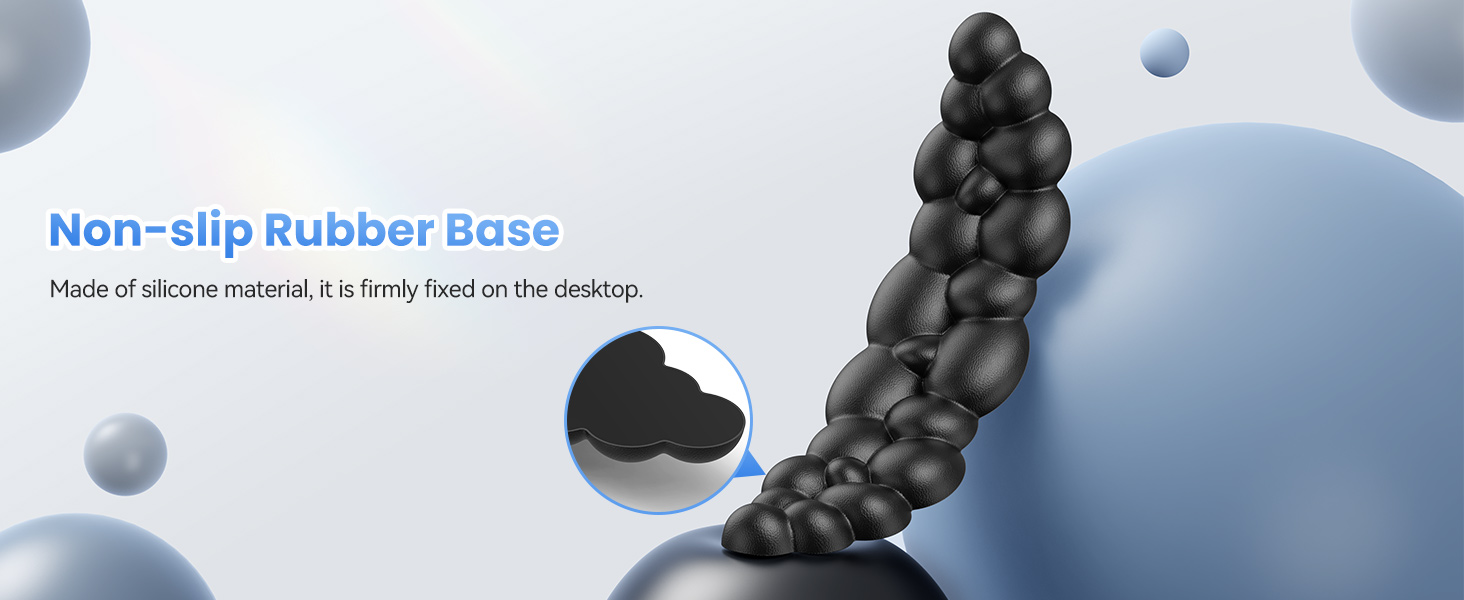 Black silicone object with bubble-like structure and non-slip rubber base. Text indicates it's made of silicone material and firmly fixed on a desktop.