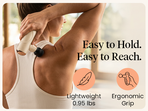 Woman reaches her upper back with a 0.95 lb creamy beige massager with an ergonomic grip.