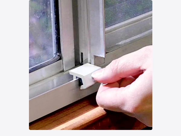 Nuk3y Sliding Window Locks being used on a window.