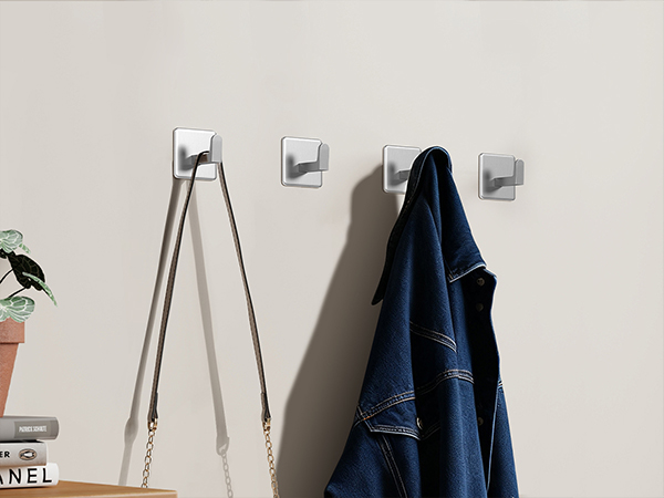 Series of images showing installation process of wall-mounted bathroom accessories, including mounting brackets and final positioning.