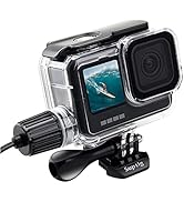 Action camera in waterproof case with front-facing screen displaying surfing image. Mounted on bracket with cable connection port visible. Clear lens and black body design.