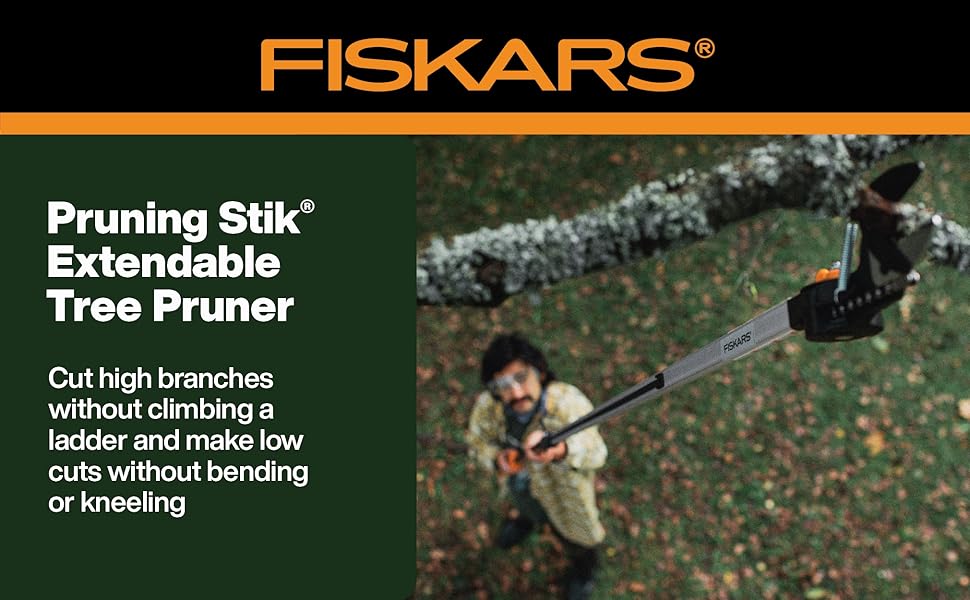 Fiskars Pruning Stik Extendable Tree Pruner man cutting tree branch up high