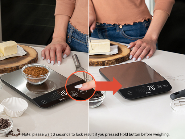 Click the hold button to lock the weight