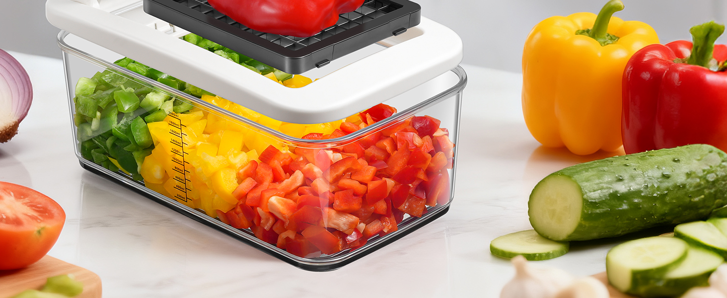Fresh cut vegetables including yellow and red bell peppers, cucumber slices, and lettuce arranged in clear storage container.
