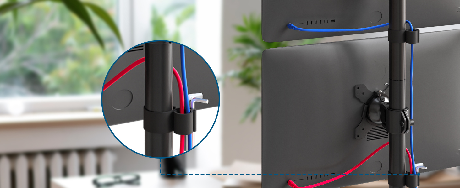 Close-up of cable management system with red and blue color-coded clips attached to a dark surface, likely for organizing computer or TV wires.