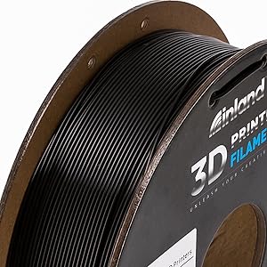 Black pla+ filament on a cardboard spool