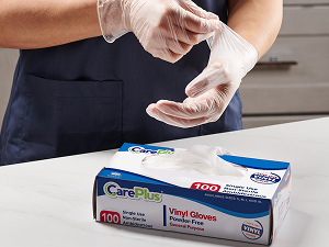 Dispenser box of CarePlus vinyl gloves designed for hygienic single-glove access