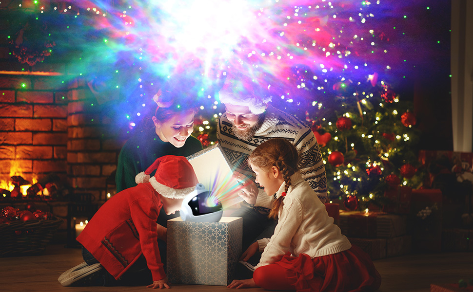 Parents give a starry sky projector as a gift to their children.