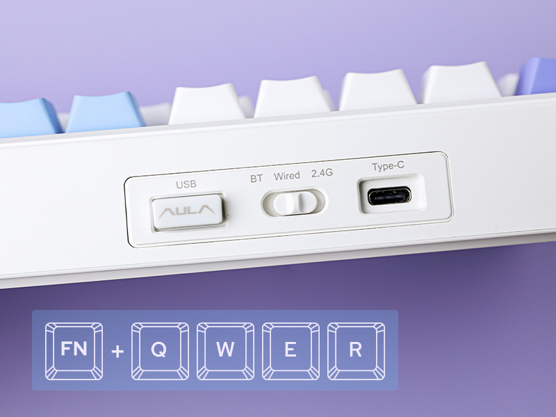 a white keyboard with a blue and white box on top of it.