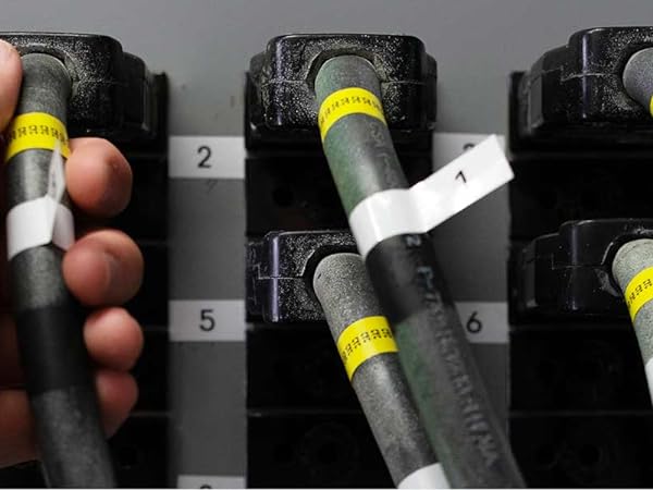 Person using TZeFX231 and TZeFX631 flexible ID labels on wires and cables