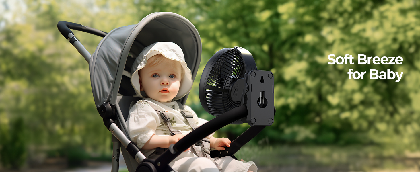 Portable fan attached to baby stroller, providing cooling breeze. Gray stroller with adjustable canopy visible, 'Soft Breeze for Baby' text overlay.