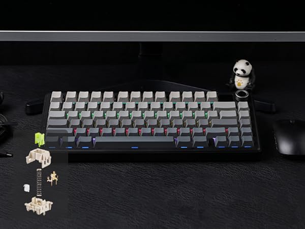 a black and silver keyboard with a black and silver mouse.