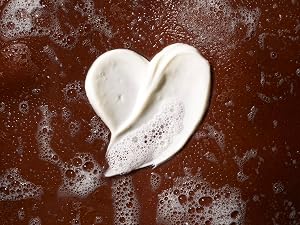 Creamy lotion of Native Moisturizing body wash in a heart shape on sensitive skin showing gentle