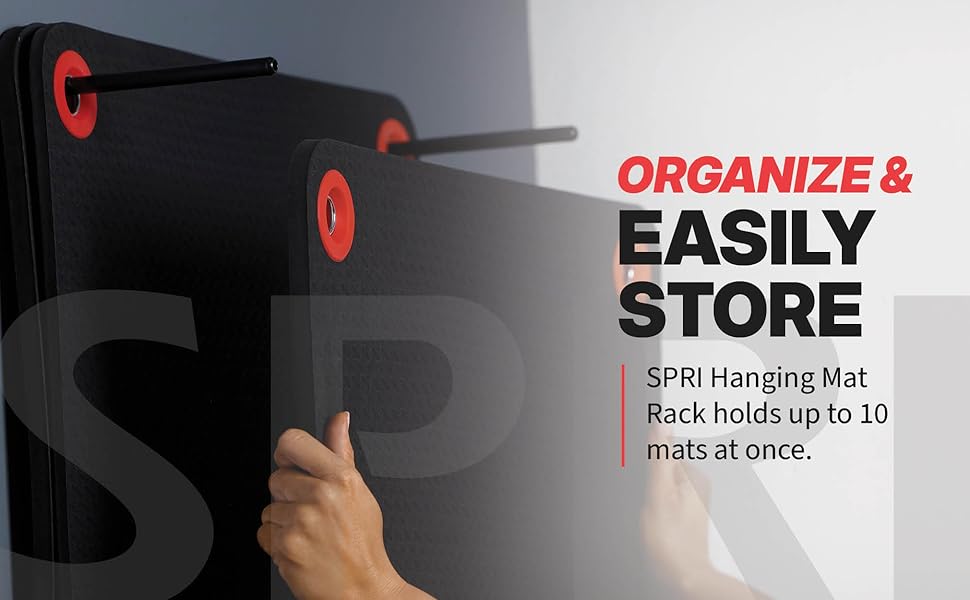 Multiple SPRI hanging mats stored on wall rack demonstrating organized gym storage solution