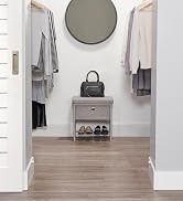 Single Seat Cushioned Bench placed inside walk-in closet under mirror