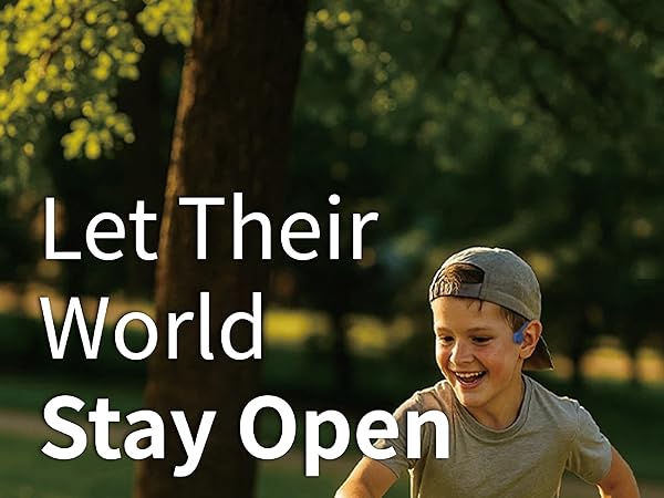 oy running outdoors wearing open-ear kids Bluetooth headphones; safe, aware, hands-free.