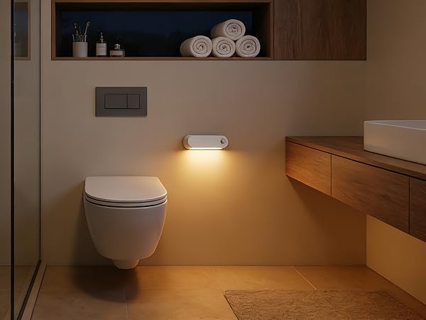 Series of images showing illuminated toilet nightlight in warm yellow glow, mounted on toilet bowl in dark bathroom setting.