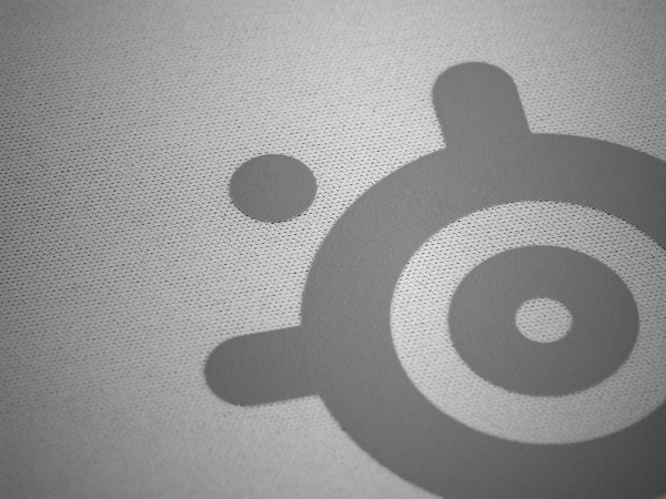 Closeup of mousepad micro-woven cloth fabric with SteelSeries logo