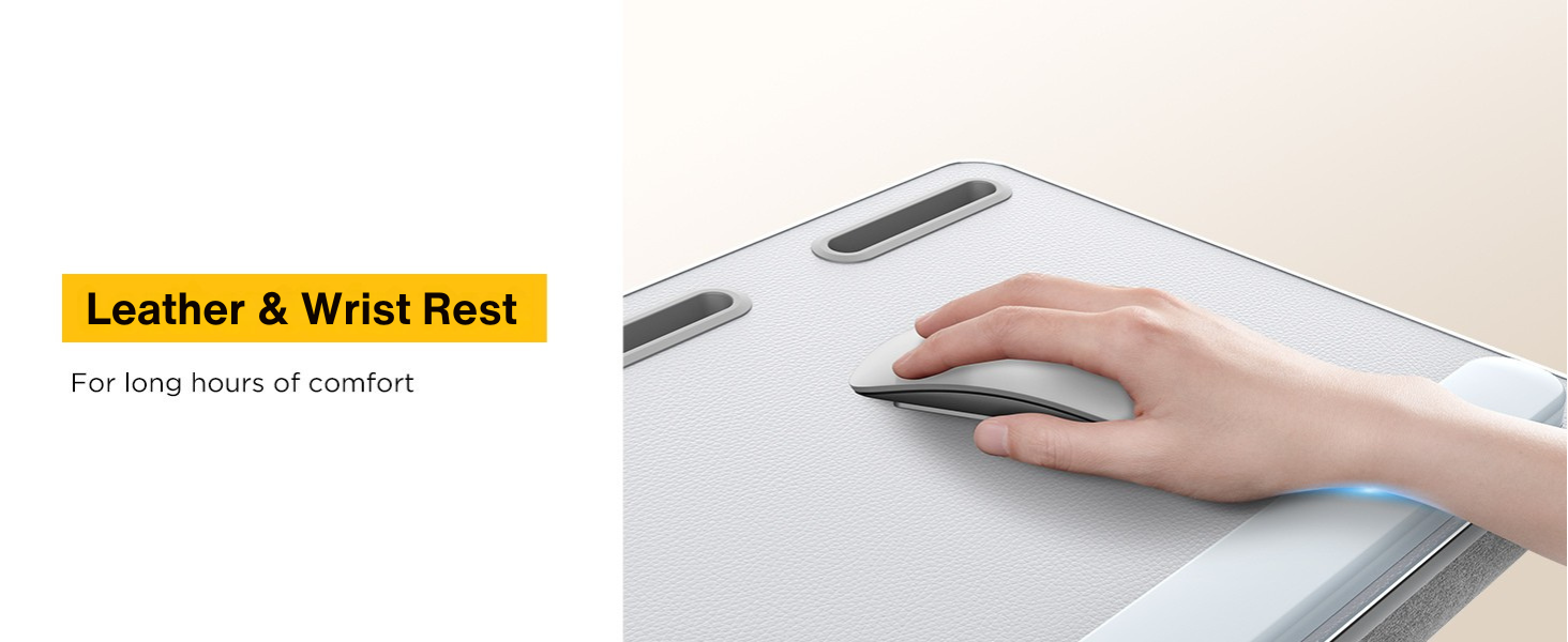 Hand resting on leather wrist pad while using wireless mouse on ergonomic lap desk.