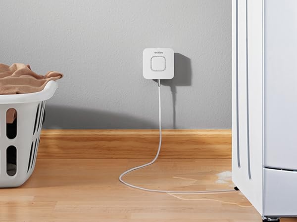 RWD42 Water Leak Detector mounted on wall next to leaking washing machine