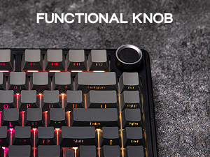 Close-up of mechanical keyboard showing detail of a functional knob or dial control with red illuminated keys
