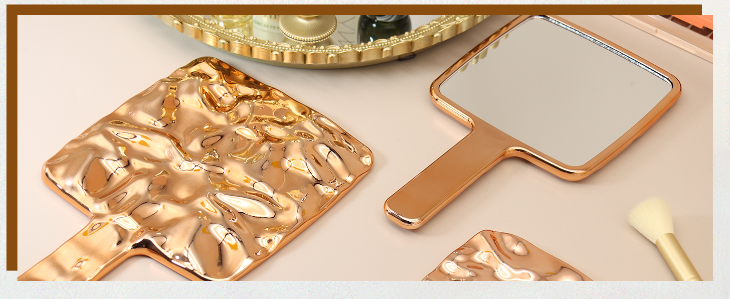 handheld mirror with held