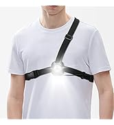 Wearable chest light with adjustable black straps, featuring a bright LED at the center. Demonstrated on a person wearing a white t-shirt.