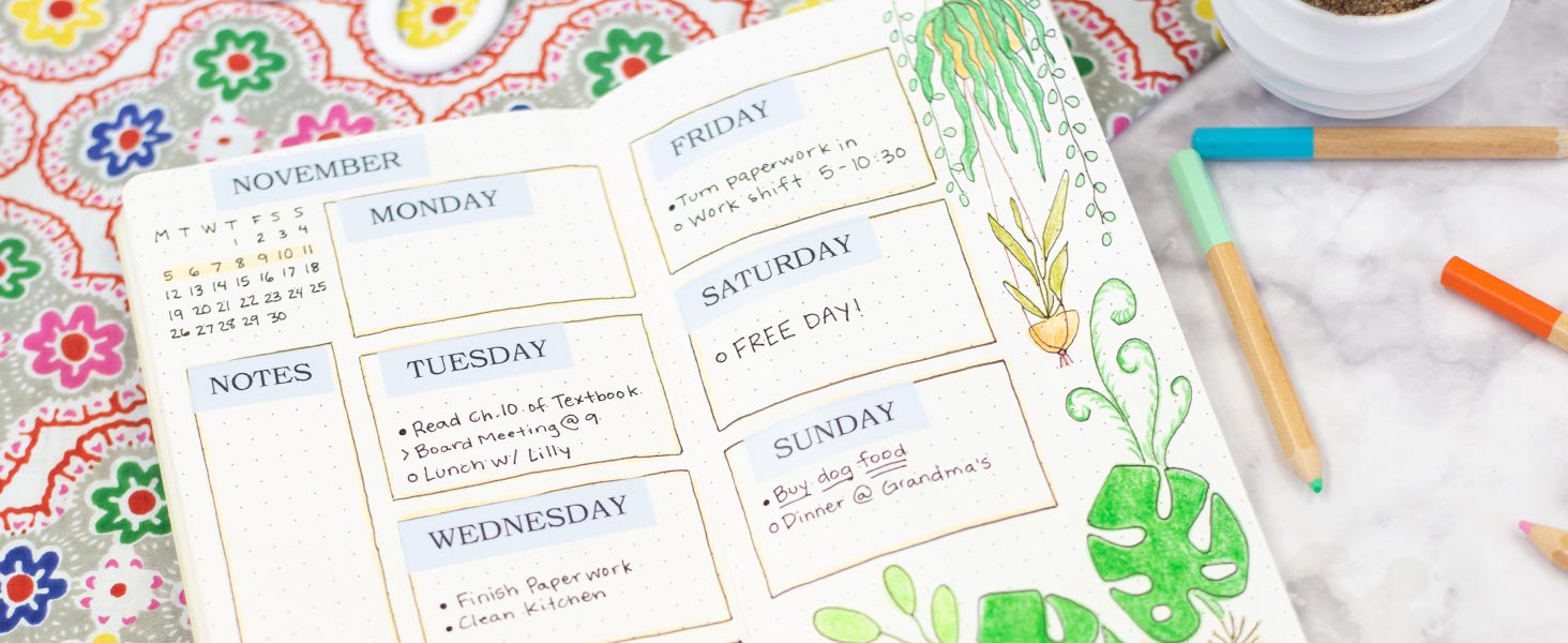 Hand-drawn bullet journal pages with labels reading the month and days