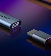 Two USB-C adapters or connectors on a reflective surface with purple and blue lighting effects.