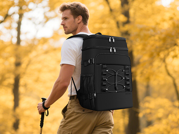 A man hiking in the forest with an ice pack backpack