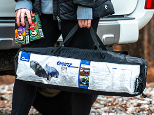 Women holding the included Napier Sportz Cove storage carrying bag