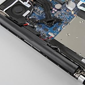 Close-up shots of electronic components, showing the internal parts of what appears to be a laptop or computer device being disassembled or serviced.