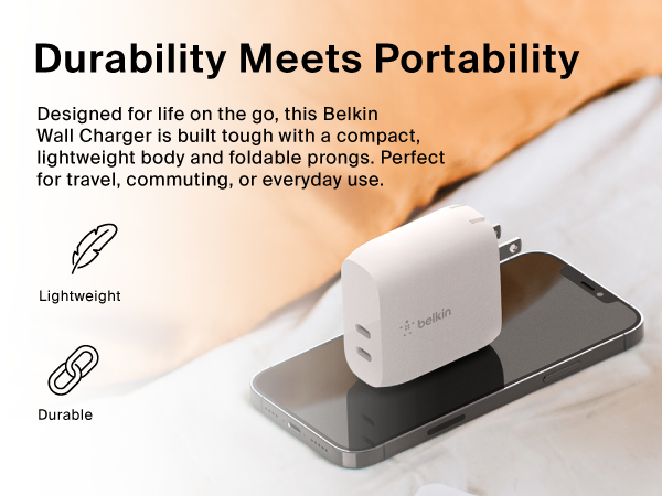  Image of portable wall charger on top of phone with text reading durability meets portability.