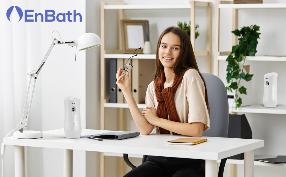 White automatic air freshener dispenser, wall-mounted or countertop, sleek and compact design.