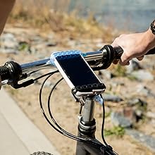 Infinity Tools holding phone on bike handlebars