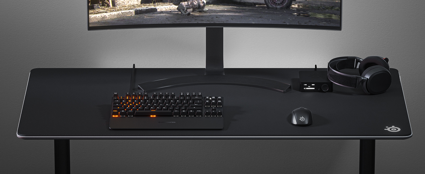 - SteelSeries desk setup with Rival 3 wireless mouse