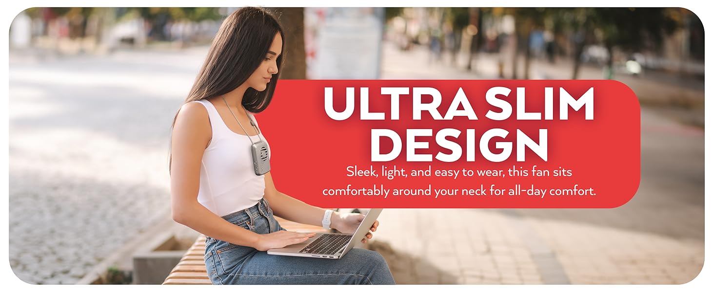 Woman working on laptop wearing gray O2Cool Rechargeable Necklace Fan, Ultra Slim Design 