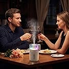 Romantic dinner lit by a humidifier&amp;amp;#39;s warm glow and calming aromatherapy mist