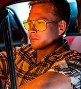 [ unused0 ] in the driver's seat of a car